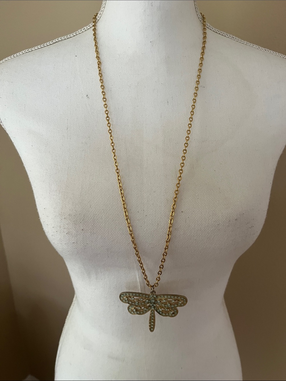 vintage-inspired brass dragonfly necklace featuring mint green bead 17”